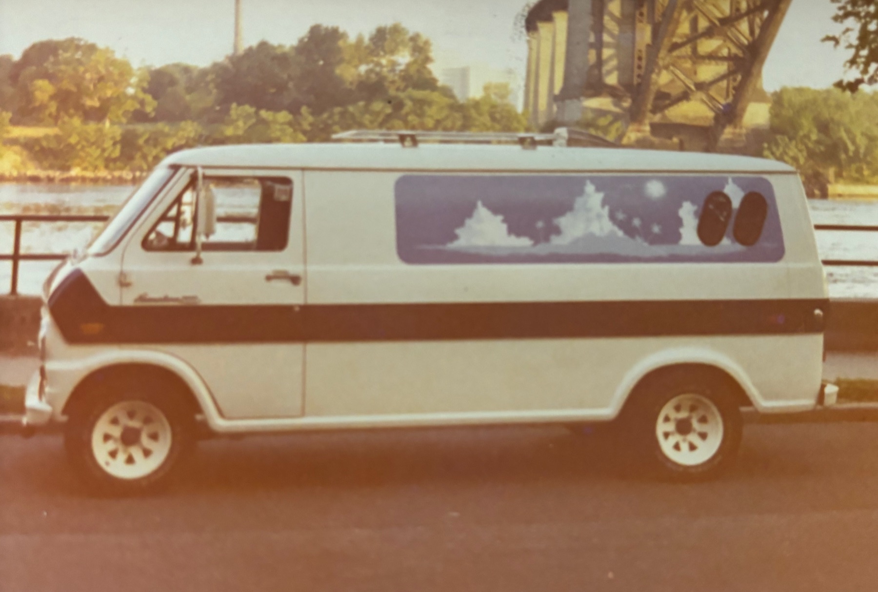 Custom-painted Ford Econoline van with airbrushed mountain mural
